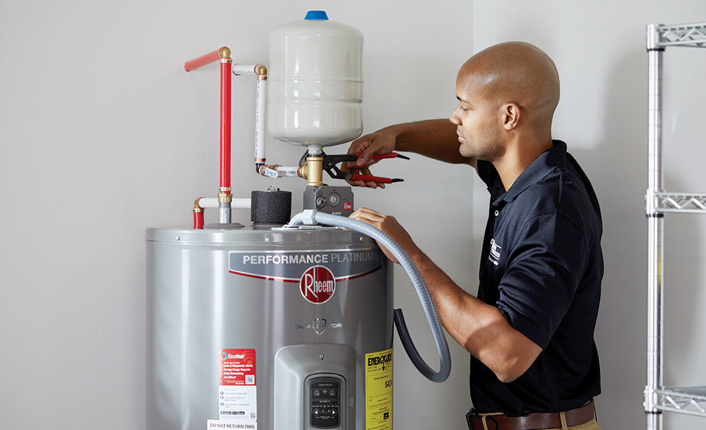 Technician installing a water heater